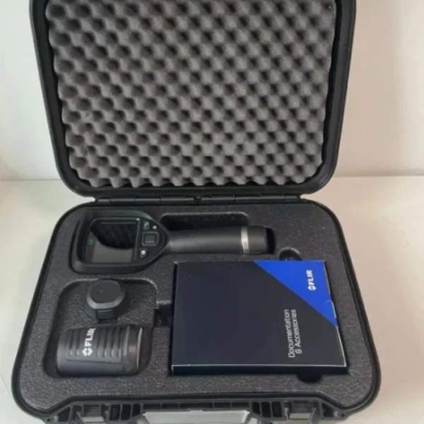 Front view of an open, black heavy-duty hard transport case containing the FLIR E8 thermal imaging camera kit. The lid is lined with egg-crate protective foam. Inside the custom foam insert sits the handheld FLIR E8 thermal camera, an additional battery or charger component, a power adapter block, and a small blue and black FLIR box labeled "Documentation & Accessories".