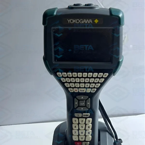 Front view of the Yokogawa YHC5150X-01 FieldMate Handheld Communicator sitting in its charging cradle. The device features a rugged grey industrial casing with green rubber corner bumpers, a yellow-and-black Yokogawa logo above a large display screen, a full QWERTY keyboard with white tactile buttons, directional navigation pad, and a numeric keypad at the bottom.
