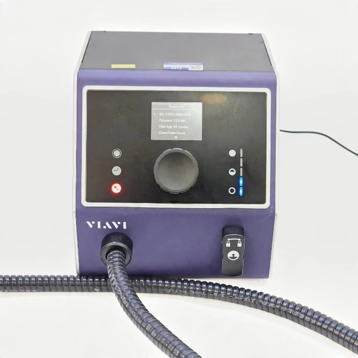Front view of the Viavi JDSU FCL-PRO-L benchtop fiber cleaner unit showing the control panel, system info screen, and cleaning hose.